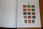 Samling x/xx i DAVO-album med fickor (sidor från 1855). 