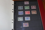 Samling ca 1900-60-tal i album med hemgjord, ngt rörig montering.