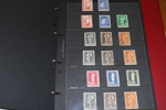 Samling ca 1900-60-tal i album med hemgjord, ngt rörig montering.