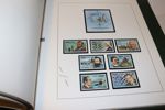 Låda med bl.a. 12 album inkl samlingar Island, Monaco och Vatikanstaten xx 1960-80-tal. Dessutom några album xx motivmärken olika länder och ett par album enklare stämplat.